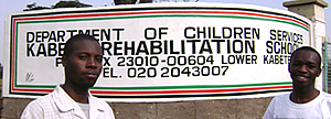 Levis and one of the students in front of the Kabete Rehabilitation School